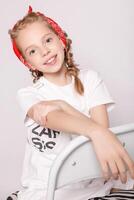 Light brown hair beautiful little girl in white t-shirt photo