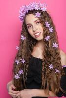 Beautiful girl with flowers in in hair photo