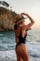 young girl black swimsuit On the Sunset photo