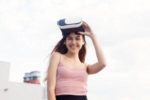 amazed young beautiful girl using new VR technology photo