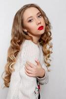 Beautiful model brunette with long curled hair photo