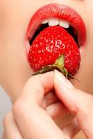 Sexy Woman Eating Strawberry photo