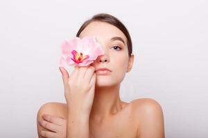 Beautiful Girl With Orchid Flowers photo