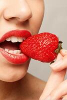 Sexy Woman Eating Strawberry photo