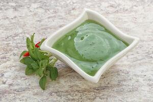 Green chili pepper and lime sauce photo