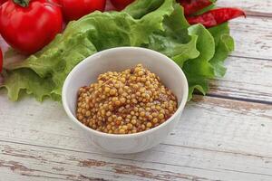 Mustard seeds sauce in the bowl photo