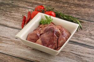 Raw chicken liver in the bowl photo