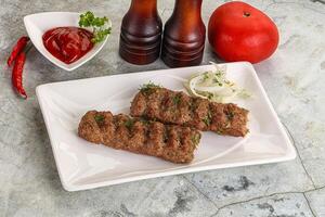 Kebab with beef served onion photo