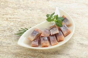 Delicous sliced herring fillet in grape sauce photo