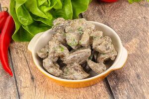 Chicken liver with cream sauce photo