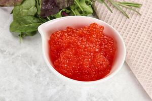 Red caviar in the bowl photo