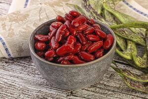 Baked red canned bean in the bowl photo