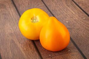 Ripe yellow bright juicy tomato photo