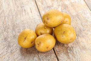Raw young baby potato heap photo