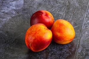 Ripe sweet juicy fresh red nectarines photo