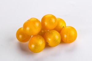 Ripe tasty yellow cherry tomato photo