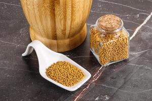 Mustard dry seeds in the bowl photo