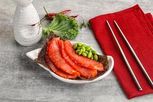 Sliced salmon sashimi in the plate photo