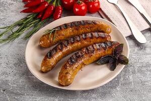 Grilled meat sausages with spices photo