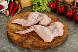 Raw chicken wings foe cooking photo