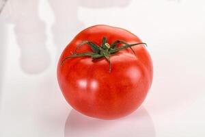 Ripe tasty and juicy tomato isolated photo