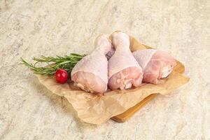 Raw chicken leg Drumstick for cooking photo