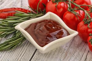 Tomato barbecue sauce on the bowl photo