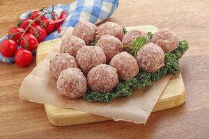 Raw pork meatball for cooking photo