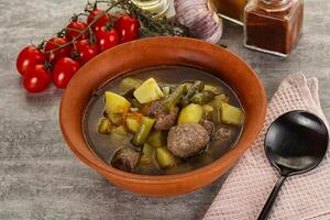 Soup with meatball and potato photo