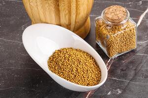 Mustard dry seeds in the bowl photo