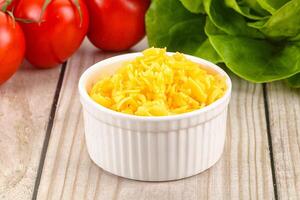 Shredded cheese in the bowl photo