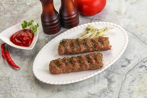 Kebab with beef served onion photo