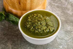 Homemade vegetarian basil pesto sauce photo