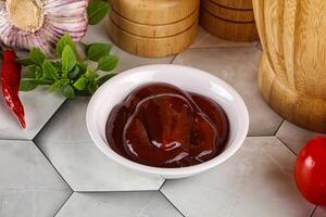 Tasty barbecue sauce in the bowl photo