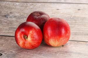 Ripe sweet juicy nectarines heap photo