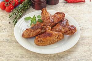 Roasted chicken wings with spicy sauce photo