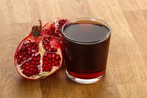 Sweet pomegranate juice in glass photo