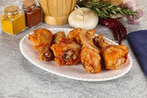 Raw marinated chicken drumstick for cooking photo