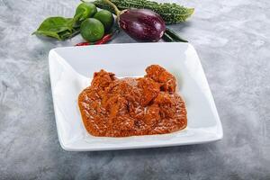 Indian cuisine - butter chicken with sauce photo