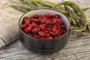 Baked red canned bean in the bowl photo