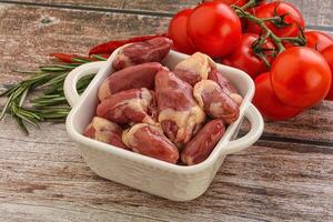 Raw chicken hearts for cooking photo