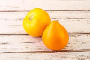 Ripe yellow bright juicy tomato photo