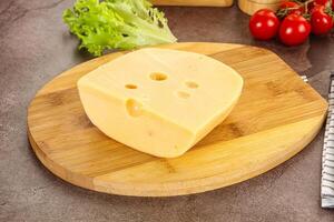 Gourmet Maasdam cheese with hole photo