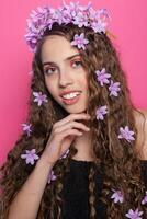 Beautiful girl with flowers in in hair photo