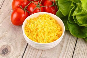 Shredded cheese in the bowl photo