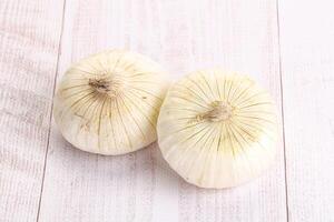 Raw white onion heap isolated photo