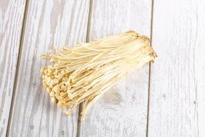 Tasty raw enoki mushroom heap photo