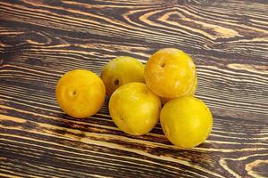 Yellow sweet plum heap fruit photo