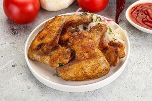 Grilled chicken wings with sauce photo