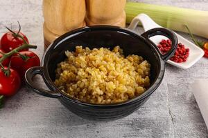 Boiled bulgur wheat in the bowl photo